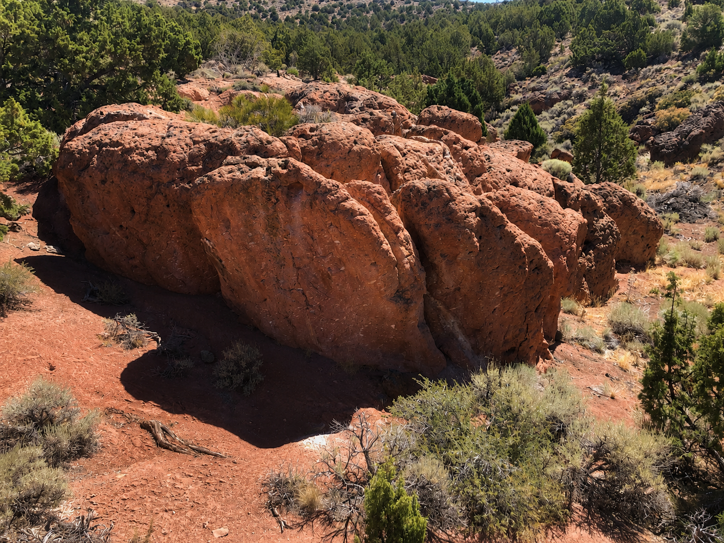 Sunlit rock formation in desert landscape